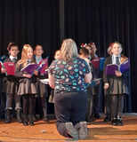 Our school choir performing for local residents at our Village Hall Fayre